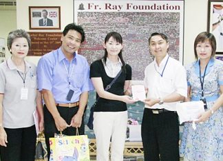 Ms. Midori Kawaguchi (third left), from the Nippon Telegraph and Telephone Public Corporation, presents a donation to Father Peter Srivorakul C.Ss.R. (third right), President of the Father Ray Foundation, to help provide daily necessities to the 850 children and students with disabilities currently living and being educated at the Father Ray Foundation in Pattaya. Also present were Boonthavee Klinsukon (first left), director of the Father Ray Day Care Center, Hideki Shizuka, Managing Director of Yoshinoki Co., Ltd. (second left), and Somnuk Phao-Ngon (first right), Customer Relations Manager at the Father Ray Foundation.